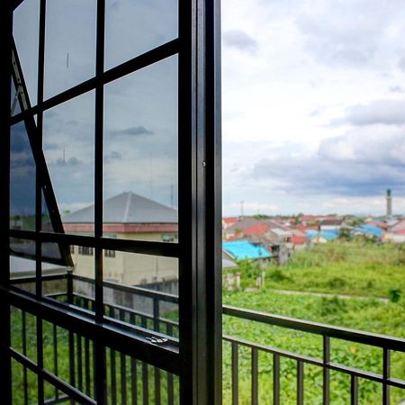 OYO 90162 Remboelan Guest House Sungai Lutus Buitenkant foto