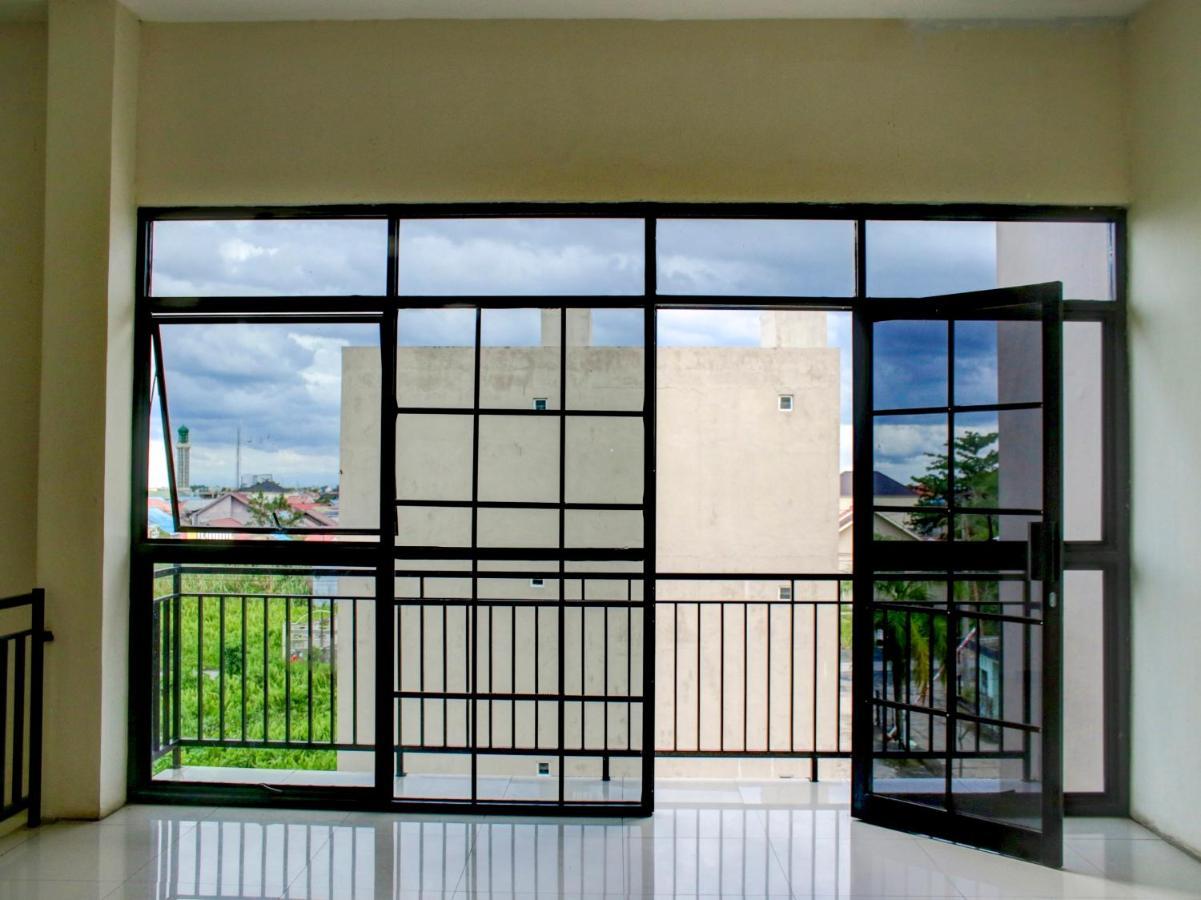 OYO 90162 Remboelan Guest House Sungai Lutus Buitenkant foto