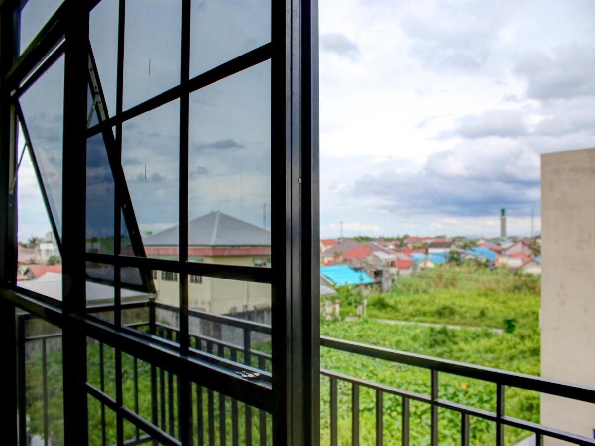 OYO 90162 Remboelan Guest House Sungai Lutus Buitenkant foto